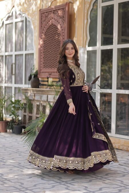 Women's Luxurious Plum Velvet Anarkali Gown with Heavy Gold Zari & Sequin Embroidery โ Perfect for Weddings & Grand Festivities